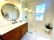 Modern bathroom with walk-in shower, marble vanity, and hexagon tile floor at 2704 Kool Park Ne Rd, Hickory, NC 28601