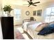 Bright bedroom with metal bed frame, dresser, and ceiling fan at 2704 Kool Park Ne Rd, Hickory, NC 28601