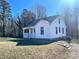 White house with a porch, visible side yard, and steps at 2704 Kool Park Ne Rd, Hickory, NC 28601