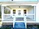 Covered front porch with white railings and steps at 2704 Kool Park Ne Rd, Hickory, NC 28601