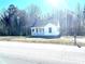 Small white house with a front porch and yard at 2704 Kool Park Ne Rd, Hickory, NC 28601