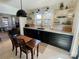 Updated kitchen featuring dark cabinetry, concrete countertops, and open shelving at 2704 Kool Park Ne Rd, Hickory, NC 28601