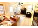 Bright living room with hardwood floors, fireplace, and comfortable seating at 2704 Kool Park Ne Rd, Hickory, NC 28601