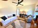 Living room with white couch, armchair, and patterned rug at 2704 Kool Park Ne Rd, Hickory, NC 28601