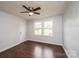 Hardwood floor bedroom with double windows and ceiling fan at 2752 21St Ne St, Hickory, NC 28601