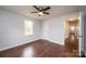 Hardwood floor bedroom with ceiling fan and access to hallway at 2752 21St Ne St, Hickory, NC 28601