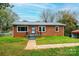 Brick ranch house with landscaped yard and walkway at 2752 21St Ne St, Hickory, NC 28601