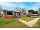 Brick ranch house with a landscaped yard and a carport at 2752 21St Ne St, Hickory, NC 28601