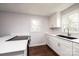 Kitchen with white cabinets, quartz countertops, and a double sink at 2752 21St Ne St, Hickory, NC 28601