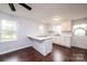 Renovated kitchen with white cabinets, island, and dark hardwood floors at 2752 21St Ne St, Hickory, NC 28601