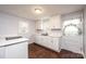 Modern white kitchen with new appliances and dark floors at 2752 21St Ne St, Hickory, NC 28601