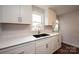 White kitchen with stainless steel appliances and a double sink at 2752 21St Ne St, Hickory, NC 28601