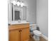 Clean bathroom with light wood vanity and toilet at 301 E Tremont Ave # 313, Charlotte, NC 28203