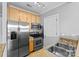 Stainless steel appliances and light wood cabinets in kitchen at 301 E Tremont Ave # 313, Charlotte, NC 28203