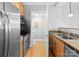 Modern kitchen features stainless steel appliances and light wood cabinets at 301 E Tremont Ave # 313, Charlotte, NC 28203