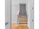 Elegant wooden staircase leading to the upper level at 301 E Tremont Ave # 313, Charlotte, NC 28203