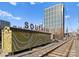 Urban street scene with light rail tracks and modern buildings in the background at 301 E Tremont Ave # 313, Charlotte, NC 28203