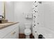 Clean bathroom with a tub shower and white tile at 305 Ideal Way, Charlotte, NC 28203