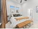 Bright bedroom featuring a comfortable bed and two benches at 305 Ideal Way, Charlotte, NC 28203