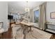 Open concept dining room with a modern chandelier and hardwood floors at 305 Ideal Way, Charlotte, NC 28203