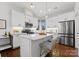 Modern kitchen with white cabinets, island, and stainless steel appliances at 305 Ideal Way, Charlotte, NC 28203