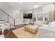 Bright living room with sectional sofa, large TV, and hardwood floors at 305 Ideal Way, Charlotte, NC 28203