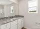 Bathroom with granite countertop, sink, and large mirror at 3258 Clover Valley Dr, Gastonia, NC 28052