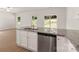 Kitchen island with granite countertop and stainless steel dishwasher at 3258 Clover Valley Dr, Gastonia, NC 28052