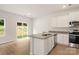 Kitchen with island, granite countertops, and stainless steel appliances at 3258 Clover Valley Dr, Gastonia, NC 28052