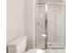 Clean shower with glass enclosure and built-in shelving at 3258 Clover Valley Dr, Gastonia, NC 28052