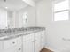 Bright bathroom with granite countertop vanity, a large mirror, and a window for natural light at 3258 Maple Ridge Dr, Gastonia, NC 28052