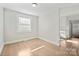 Bright bedroom with neutral walls and hardwood floors, offering a clean and comfortable space at 3724 Commonwealth Ave, Charlotte, NC 28205