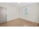 Inviting bedroom features hardwood floors, fresh paint, and natural light at 3724 Commonwealth Ave, Charlotte, NC 28205