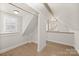 Light-filled bedroom space with hardwood flooring, closet, and dormer window at 3724 Commonwealth Ave, Charlotte, NC 28205