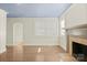 Spacious living room featuring natural light, hardwood floors, and a fireplace, perfect for entertaining at 3724 Commonwealth Ave, Charlotte, NC 28205