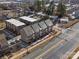 Aerial view of townhouses, modern architecture, and surrounding neighborhood at 3731 S Tryon St, Charlotte, NC 28217