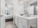 Double vanity bathroom with view into bedroom at 3731 S Tryon St, Charlotte, NC 28217