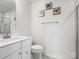 Simple bathroom with white vanity and shower at 3731 S Tryon St, Charlotte, NC 28217