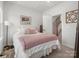 Bright bedroom with cozy bedding and access to upper hallway at 3731 S Tryon St, Charlotte, NC 28217