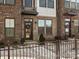 Front entrance of townhome with brick facade and landscaping at 3731 S Tryon St, Charlotte, NC 28217