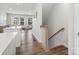 Bright hallway with hardwood floors and staircase at 3731 S Tryon St, Charlotte, NC 28217