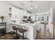 Modern kitchen with white cabinets, an island and breakfast bar at 3731 S Tryon St, Charlotte, NC 28217