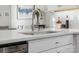 Modern kitchen sink with sleek faucet and quartz countertop at 3731 S Tryon St, Charlotte, NC 28217