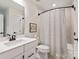 Neutral toned bathroom features a shower and tub combination and modern vanity with a solid surface countertop at 5066 Summer Surprise Ln, Charlotte, NC 28215