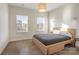 Bright bedroom with wood flooring and large windows at 5066 Summer Surprise Ln, Charlotte, NC 28215