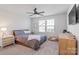 Comfortable bedroom with ceiling fan and dresser at 5066 Summer Surprise Ln, Charlotte, NC 28215