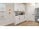 White kitchen cabinets and countertop with coffee bar area at 5066 Summer Surprise Ln, Charlotte, NC 28215