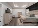 Spacious main bedroom with king-size bed, dresser, and dark accent wall at 5066 Summer Surprise Ln, Charlotte, NC 28215