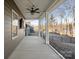 Covered back patio features a ceiling fan, string lights, and views of the backyard at 5066 Summer Surprise Ln, Charlotte, NC 28215