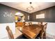 Bright dining room with a wood table and chairs, adjacent to the kitchen at 5241 Whitewater Dr, Hickory, NC 28601